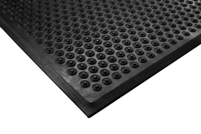 Anti-fatigue mat with coin pattern